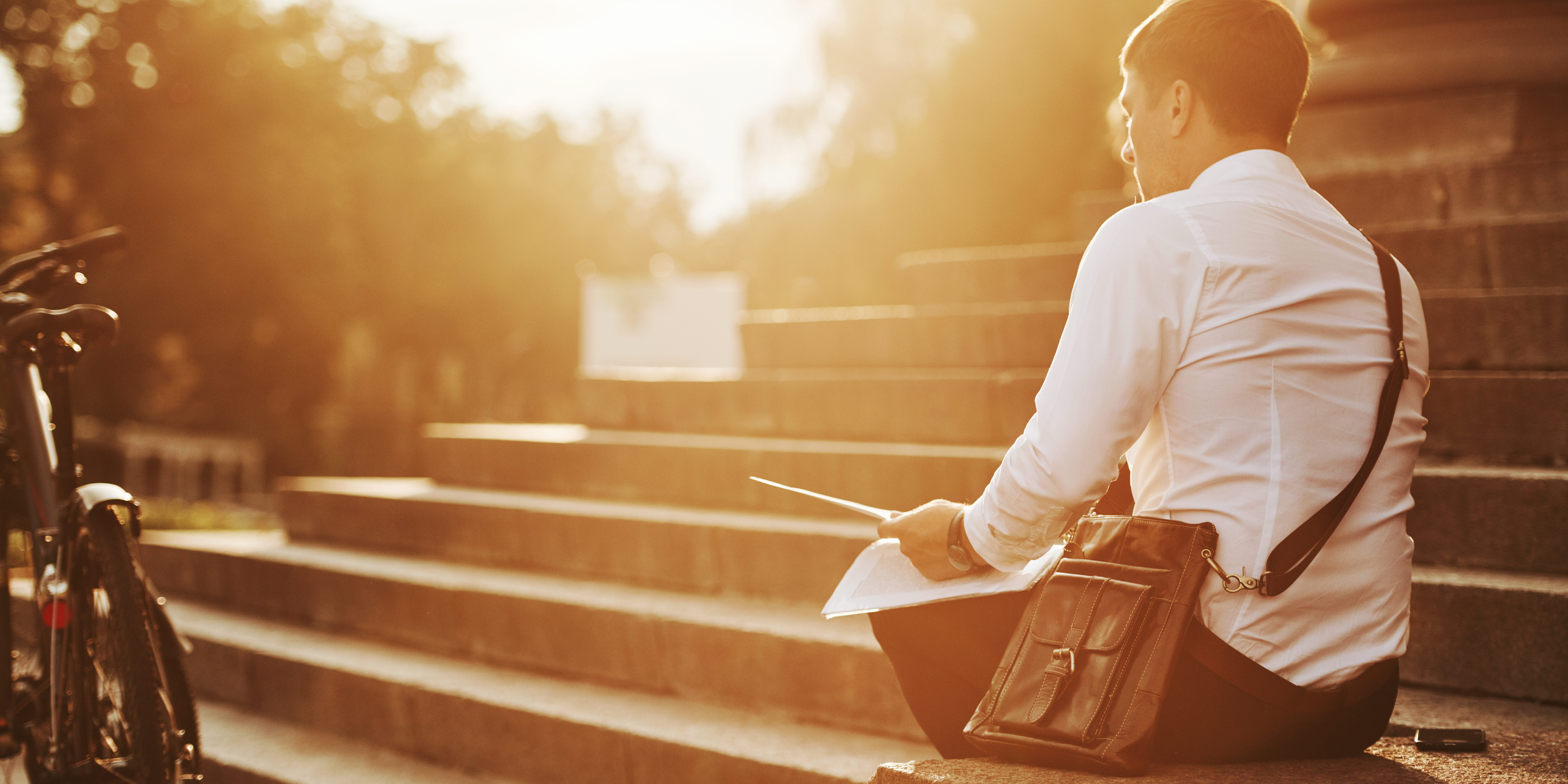 Professional contemplating decision to quit job and start business in thoughtful moment evaluating career transition