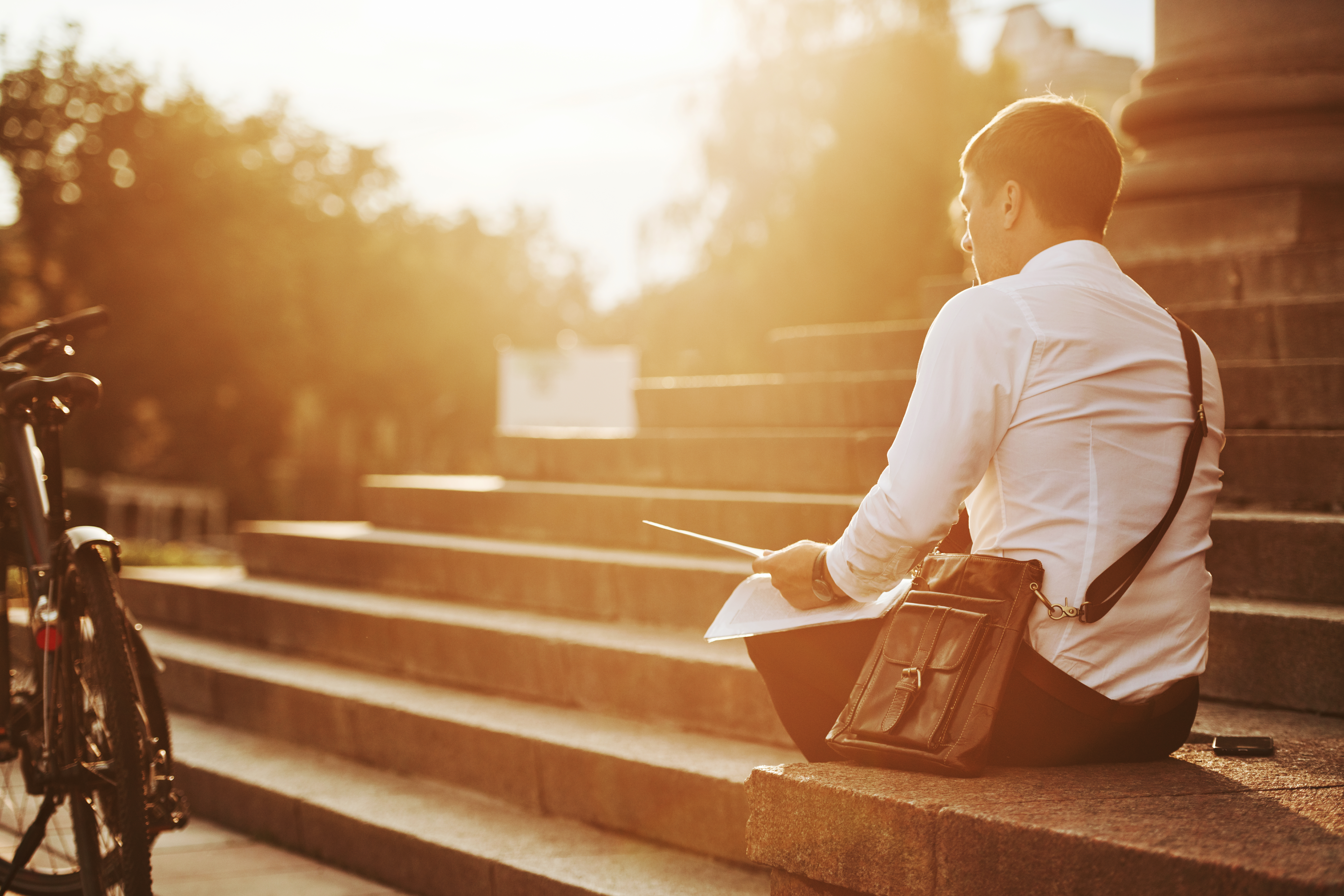 Professional contemplating decision to quit job and start business in thoughtful moment evaluating career transition